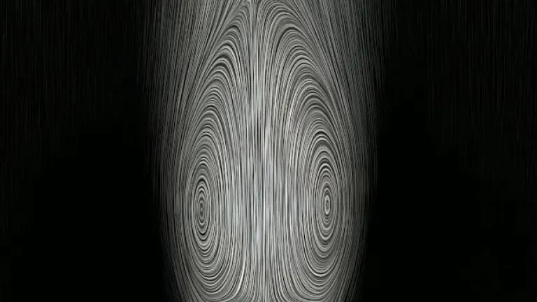 greyscale image of a separated vortex ring above a porous disc